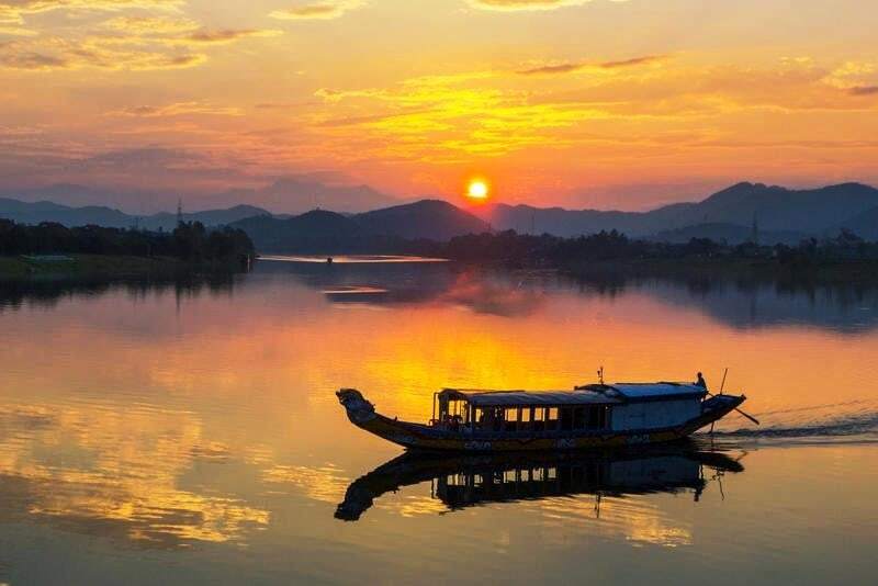 cruise along the perfume river to watch the sunset